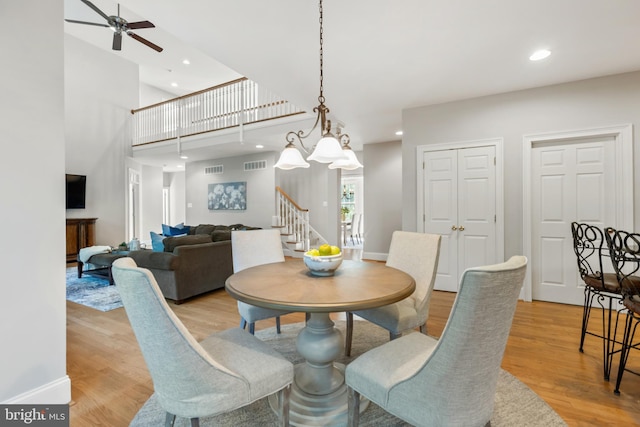 11 Woods Edge Rd, West Chester, PA 19382 - dining room featuring light wood-style floors, a ceiling fan, recessed lighting, stairway, and a high ceiling