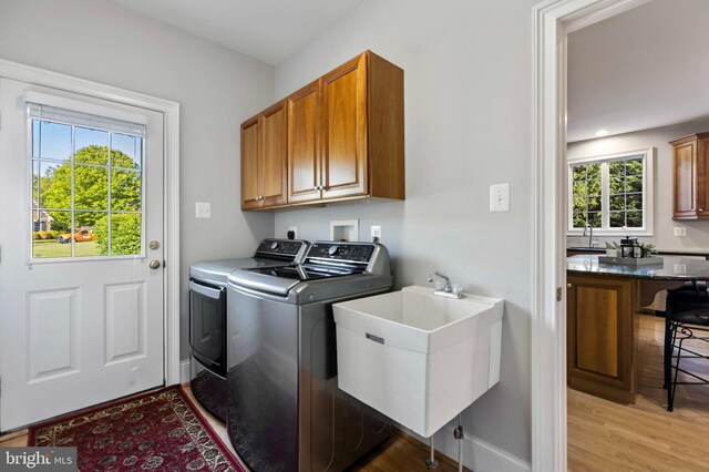 11 Woods Edge Rd, West Chester, PA 19382 - laundry room featuring washing machine and dryer, cabinet space, light wood-type flooring, and baseboards