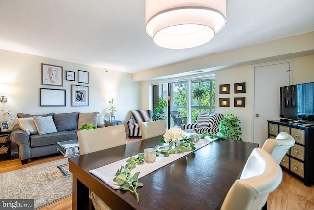 1600 N Oak St Unit 324, Arlington, VA 22209 - dining area featuring light wood-style flooring