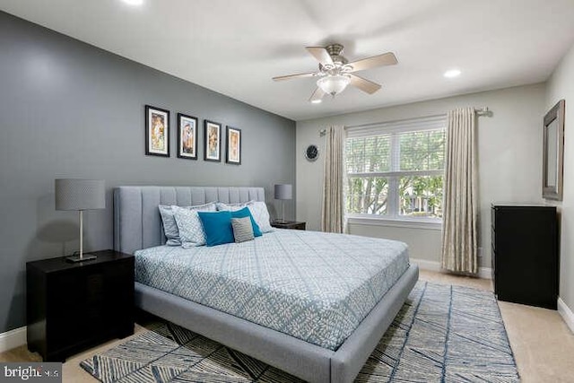 bedroom with baseboards, recessed lighting, ceiling fan, and light carpet