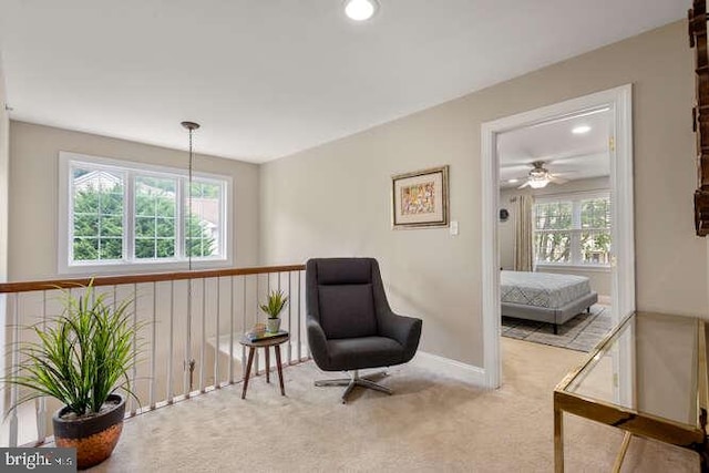 living area featuring carpet flooring, recessed lighting, and baseboards