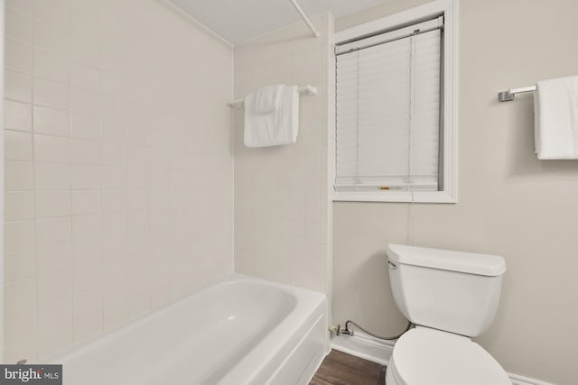 704 F St NE, Washington, DC 20002 - full bathroom featuring toilet, baseboards, wood finished floors, and shower / bath combination