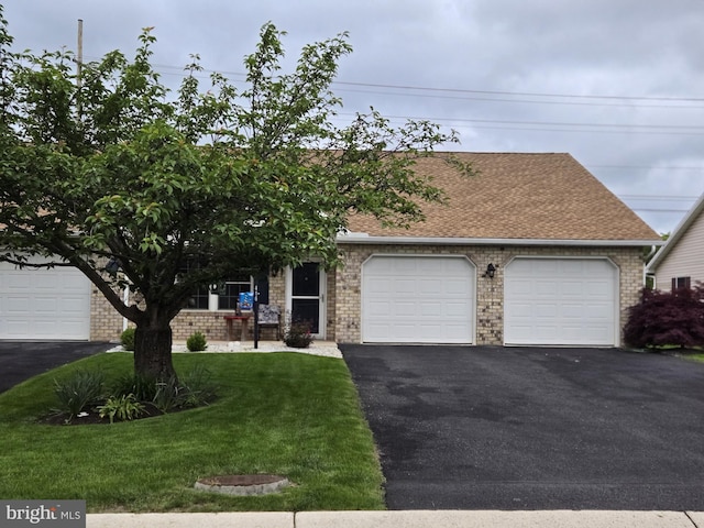 416 Kara Way, Shippensburg, PA 17257 - view of front facade with driveway, a garage, brick siding, a front yard, and roof with shingles
