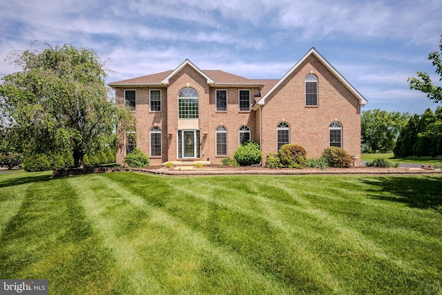 143 Bakerfield Dr, Middletown, DE 19709 - view of front facade with a front yard and brick siding