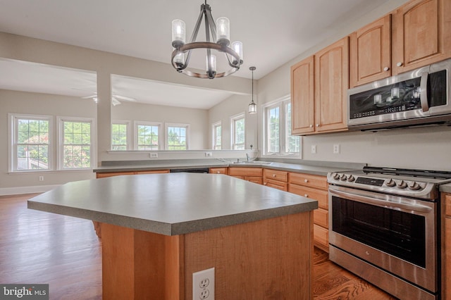 143 Bakerfield Dr, Middletown, DE 19709 - kitchen featuring stainless steel appliances, wood finished floors, plenty of natural light, and light brown cabinetry