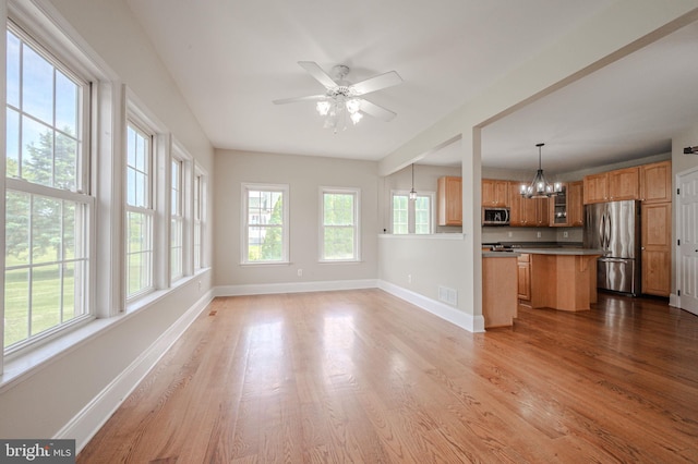 143 Bakerfield Dr, Middletown, DE 19709 - kitchen with stainless steel appliances, a chandelier, baseboards, and wood finished floors