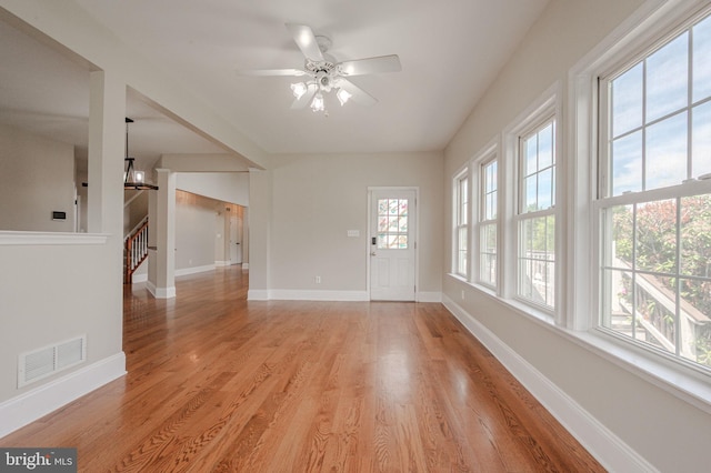 143 Bakerfield Dr, Middletown, DE 19709 - unfurnished room with light wood-type flooring, baseboards, a ceiling fan, and stairs