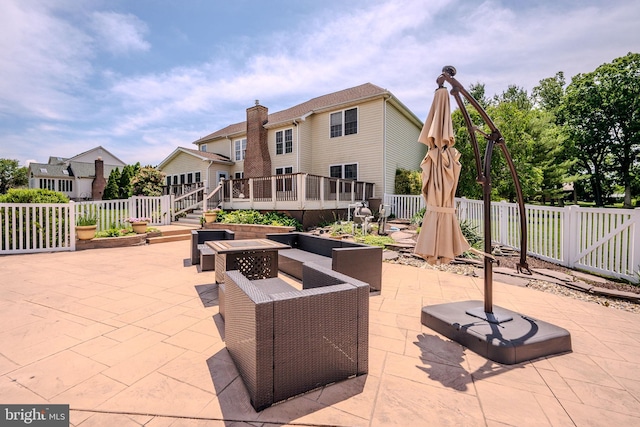 143 Bakerfield Dr, Middletown, DE 19709 - fenced backyard with a patio and a wooden deck