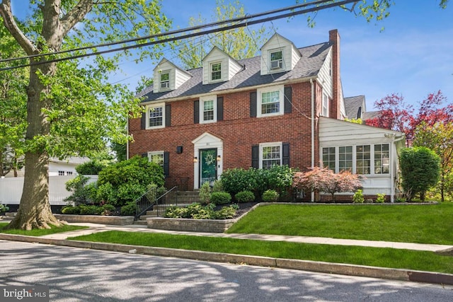 330 Wood Ln, Haddonfield, NJ 08033 - view of front of house featuring brick siding, a chimney, a front yard, and a garage