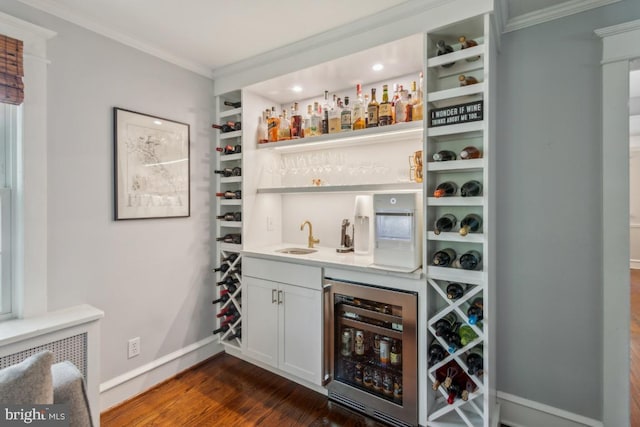 330 Wood Ln, Haddonfield, NJ 08033 - indoor wet bar featuring beverage cooler, ornamental molding, dark wood finished floors, baseboards, and recessed lighting
