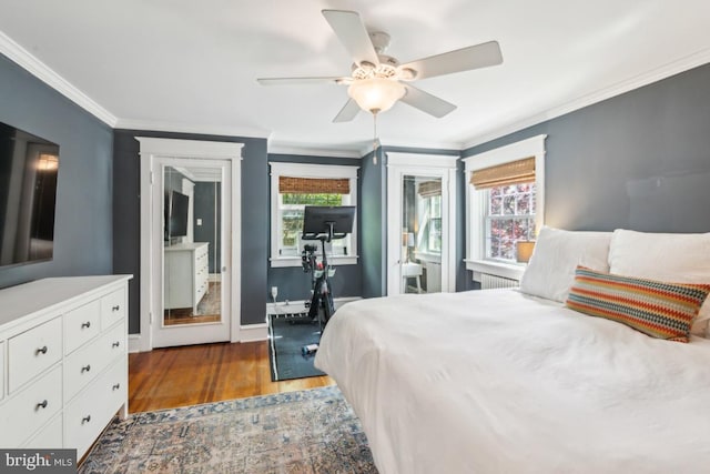 330 Wood Ln, Haddonfield, NJ 08033 - bedroom with wood finished floors, multiple windows, crown molding, baseboards, and ceiling fan
