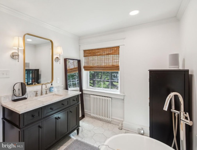 330 Wood Ln, Haddonfield, NJ 08033 - bathroom with radiator heating unit, a soaking tub, crown molding, vanity, and recessed lighting