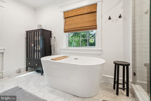 330 Wood Ln, Haddonfield, NJ 08033 - bathroom with crown molding, a soaking tub, a shower, and baseboards