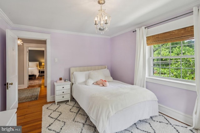 330 Wood Ln, Haddonfield, NJ 08033 - bedroom featuring ornamental molding, wood finished floors, baseboards, and a chandelier
