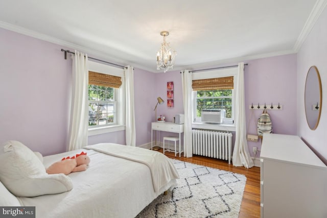330 Wood Ln, Haddonfield, NJ 08033 - bedroom with radiator heating unit, a chandelier, multiple windows, crown molding, and wood finished floors