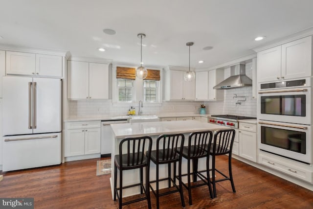 330 Wood Ln, Haddonfield, NJ 08033 - kitchen with white appliances, wall chimney range hood, light countertops, white cabinets, and recessed lighting