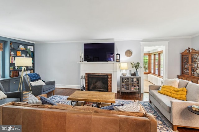 330 Wood Ln, Haddonfield, NJ 08033 - living room with radiator, wood finished floors, a fireplace, ornamental molding, and baseboards
