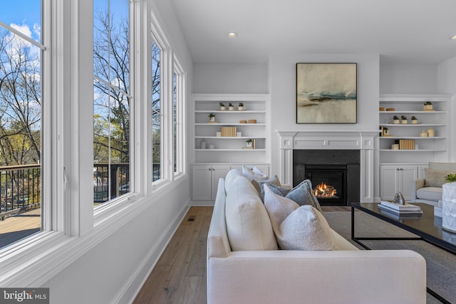 629 S Orange St, Media, PA 19063 - living room with plenty of natural light, a lit fireplace, dark wood-style floors, and recessed lighting
