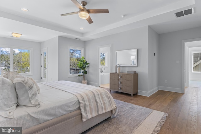 629 S Orange St, Media, PA 19063 - bedroom with wood-type flooring, multiple windows, baseboards, recessed lighting, and ceiling fan