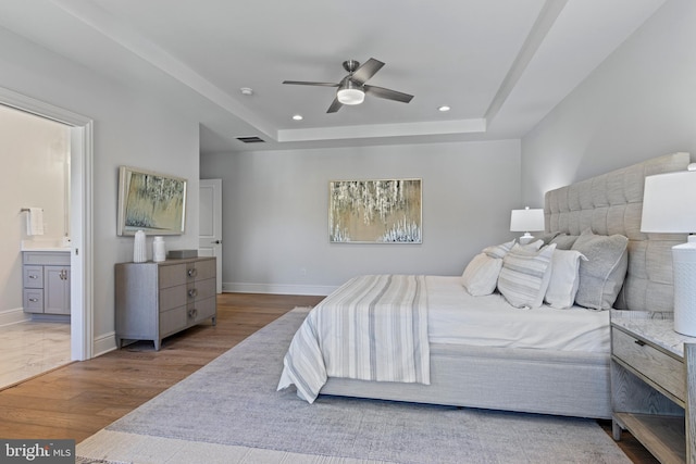 629 S Orange St, Media, PA 19063 - bedroom featuring recessed lighting, wood finished floors, a raised ceiling, baseboards, and ensuite bath