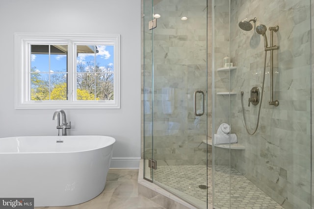 629 S Orange St, Media, PA 19063 - full bathroom featuring a stall shower, a freestanding bath, marble finish flooring, and baseboards