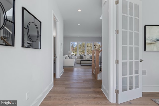 629 S Orange St, Media, PA 19063 - hall featuring wood finished floors, french doors, baseboards, and recessed lighting