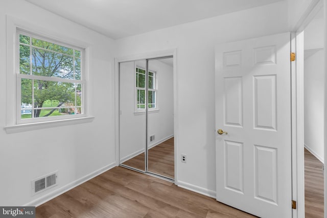 6913 Fulford St, Clinton, MD 20735 - unfurnished bedroom with wood finished floors, baseboards, and a closet