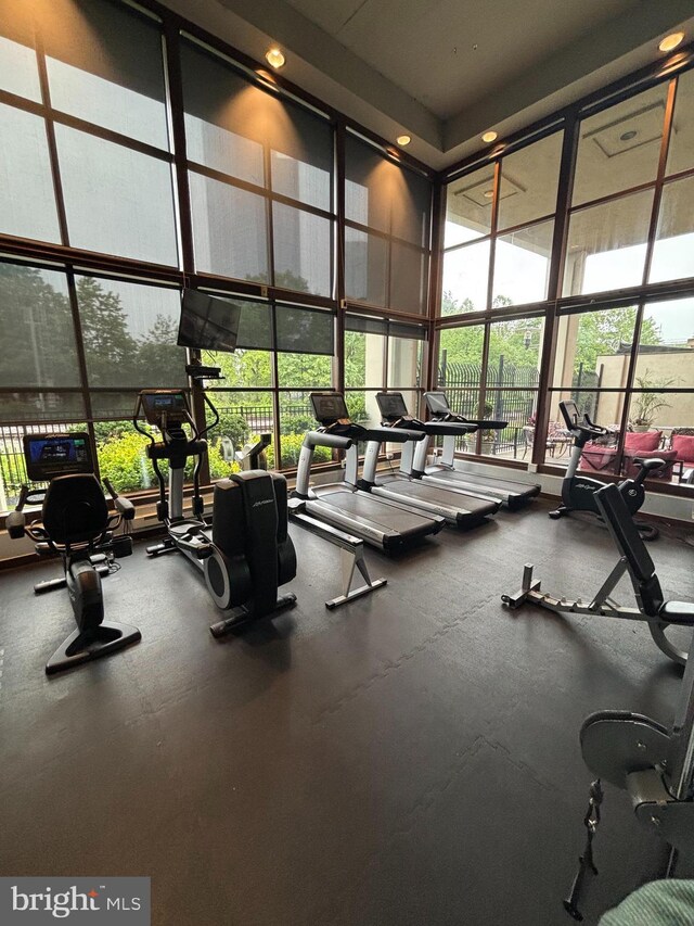 2429 Locust St Unit 319, Philadelphia, PA 19103 - exercise room featuring a high ceiling, a wall of windows, and recessed lighting