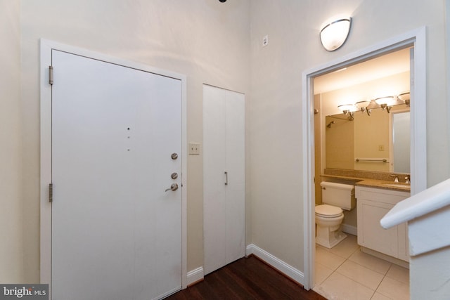 2429 Locust St Unit 319, Philadelphia, PA 19103 - entryway with a towering ceiling, baseboards, and light tile patterned floors
