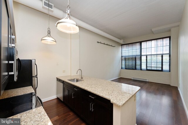 2429 Locust St Unit 319, Philadelphia, PA 19103 - kitchen featuring a sink, dishwasher, dark wood-style flooring, baseboards, and a baseboard heating unit