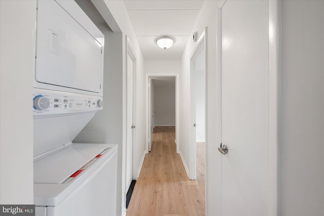 6270 Edsall Rd Unit 101, Alexandria, VA 22312 - washroom featuring stacked washer / dryer and light wood-style flooring