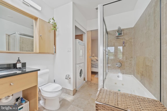 961 Randolph St NW Unit 3, Washington, DC 20011 - full bathroom with stacked washer / drying machine, tiled shower, toilet, vanity, and a tub with jets
