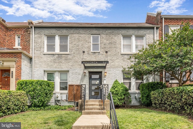 961 Randolph St NW Unit 3, Washington, DC 20011 - townhome / multi-family property with a front lawn and brick siding