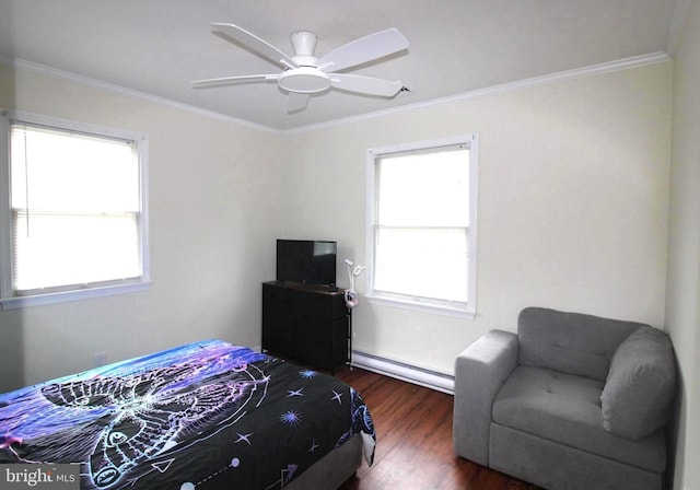 17 Greenridge Ave, Ridgely, MD 21660 - bedroom with baseboard heating, dark wood-type flooring, ornamental molding, and a ceiling fan