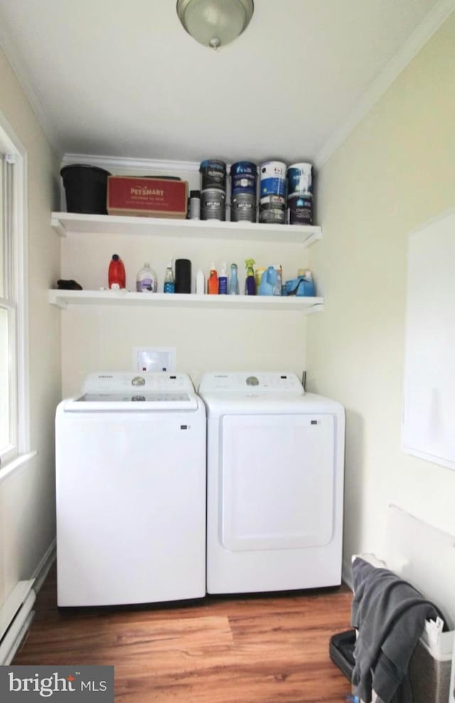 17 Greenridge Ave, Ridgely, MD 21660 - laundry area with washer and dryer, a baseboard heating unit, crown molding, and wood finished floors