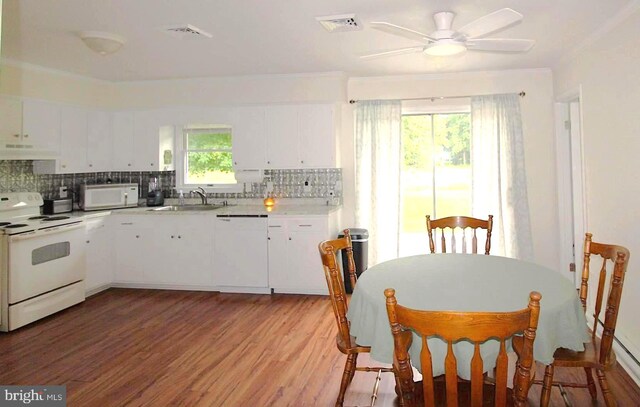 17 Greenridge Ave, Ridgely, MD 21660 - kitchen with white appliances, a sink, decorative backsplash, under cabinet range hood, and light wood-style floors