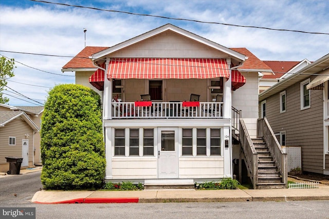104 11th St, Ocean City, MD 21842 - bungalow-style house featuring stairs and a balcony