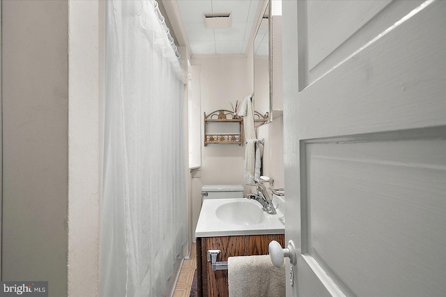 104 11th St, Ocean City, MD 21842 - bathroom featuring vanity, curtained shower, and toilet