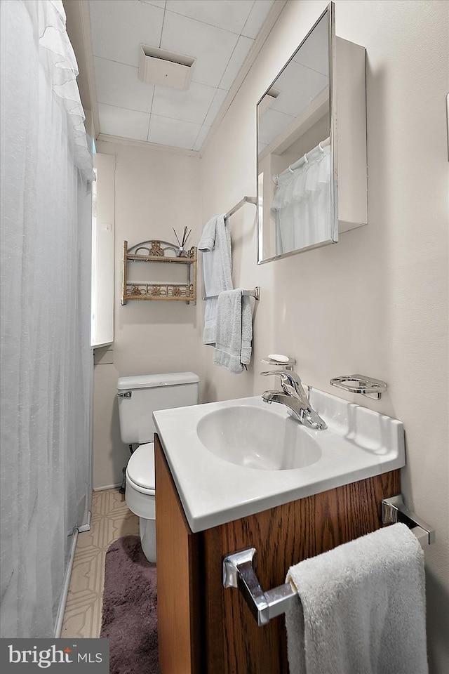 104 11th St, Ocean City, MD 21842 - full bathroom with toilet, vanity, a shower with shower curtain, and tile patterned floors