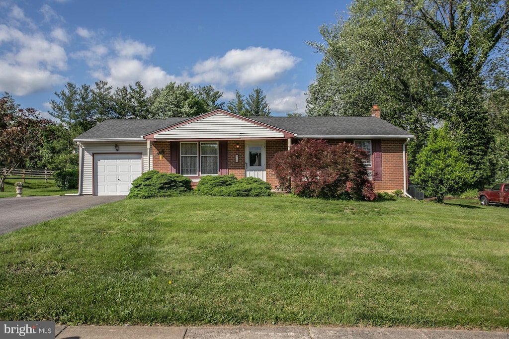 918 Independence Rd, Norristown, PA 19403 - single story home featuring an attached garage, driveway, brick siding, a chimney, and a front yard