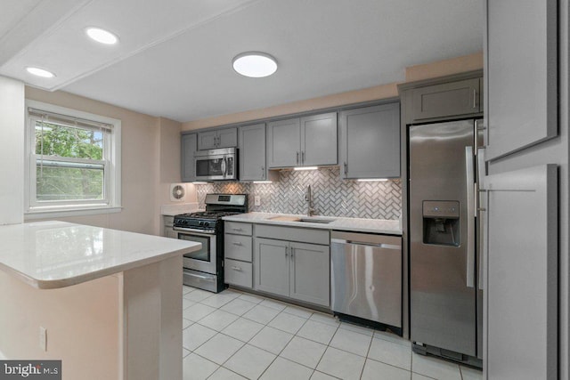911 Circle Dr, Baltimore, MD 21227 - kitchen featuring stainless steel appliances, gray cabinets, a sink, and recessed lighting