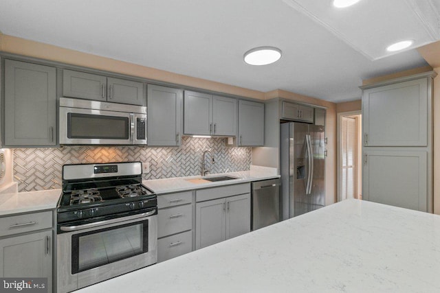 911 Circle Dr, Baltimore, MD 21227 - kitchen with stainless steel appliances, a sink, gray cabinets, and tasteful backsplash