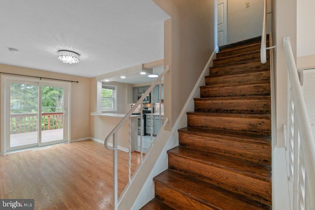 911 Circle Dr, Baltimore, MD 21227 - stairway with baseboards, wood finished floors, and recessed lighting
