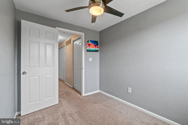 911 Circle Dr, Baltimore, MD 21227 - unfurnished bedroom featuring carpet flooring, baseboards, ceiling fan, and a closet