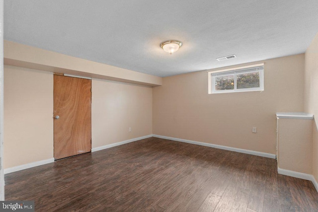 911 Circle Dr, Baltimore, MD 21227 - below grade area with wood finished floors and baseboards