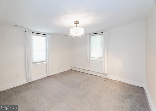 131 Main, Medford, NJ 08055 - carpeted empty room featuring healthy amount of natural light, a baseboard heating unit, and baseboards