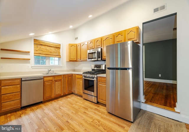 131 Main, Medford, NJ 08055 - kitchen with appliances with stainless steel finishes, lofted ceiling, a sink, light wood finished floors, and open shelves