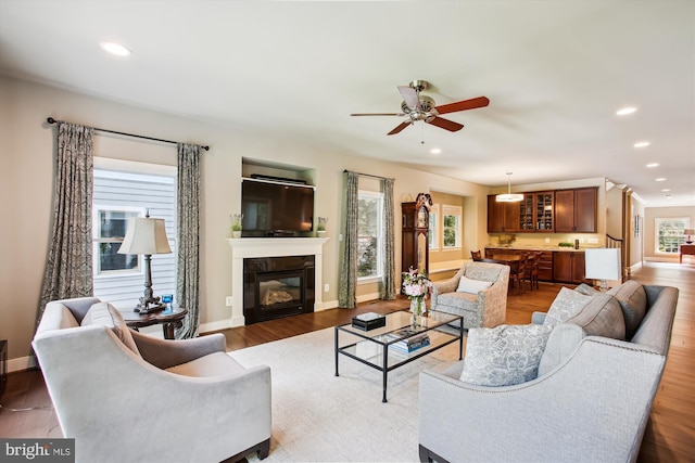 2371 N Edgewood St, Arlington, VA 22207 - living room featuring recessed lighting, ceiling fan, wood finished floors, baseboards, and a glass covered fireplace