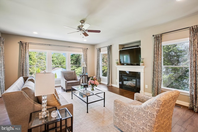 2371 N Edgewood St, Arlington, VA 22207 - living area with wood finished floors, ceiling fan, healthy amount of natural light, and recessed lighting