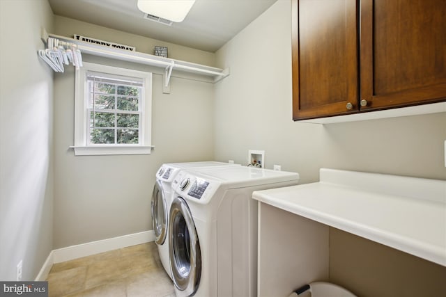 2371 N Edgewood St, Arlington, VA 22207 - washroom with cabinet space, washing machine and clothes dryer, baseboards, and light tile patterned floors